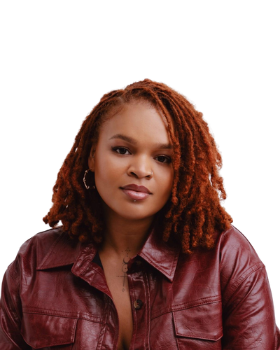 A close up headshot of a Black woman with orange locs, wearing a red leather jacket and a gold hoop earring.